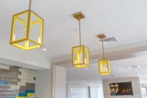 Three yellow rectangular pendant lights