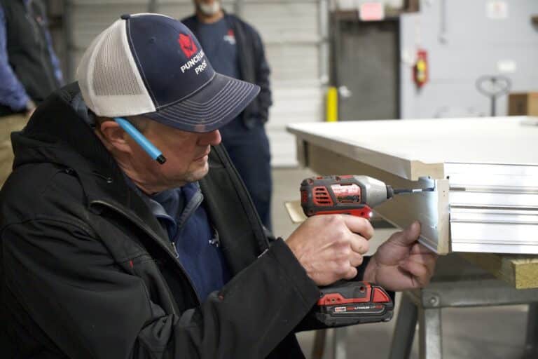handyman preparing to adjust a door