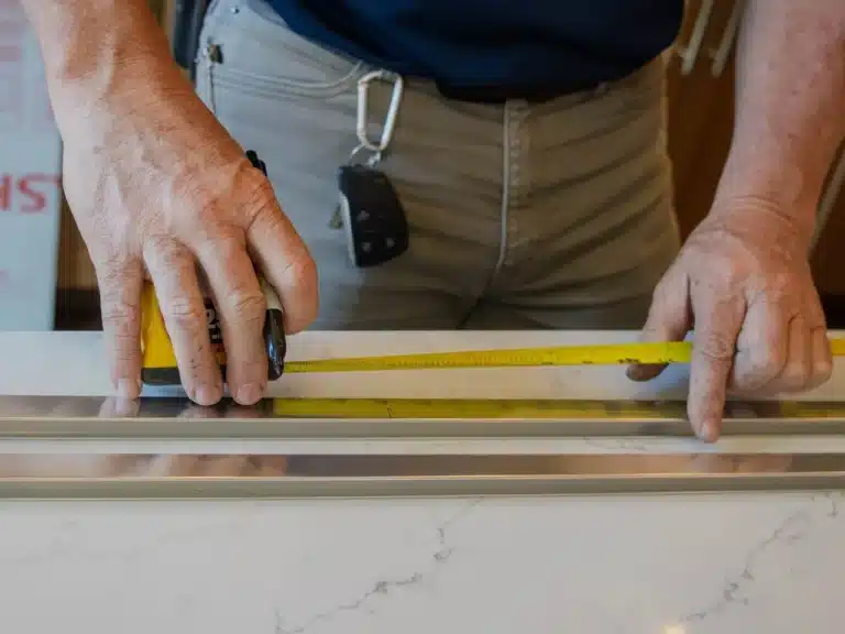 Drywall Installation & Repair 1 Punch List Pros team member installing and repairing drywall, ensuring seamless walls and a flawless finish.