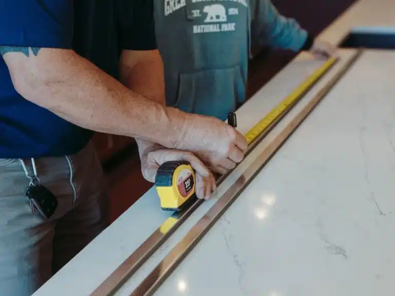 Countertop Installation or Repair 1 Installer fitting a new kitchen countertop, ensuring a precise and seamless installation that elevates the overall design.