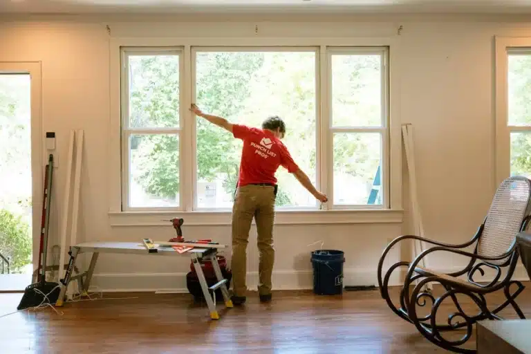 Window Installation & Replacement 1 handyman installing a window